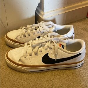 Nike  Womens White Low-Top Sneakers with Black Swoosh and Brown Trim